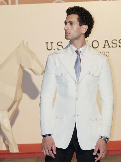 Our client at the U.S. Polo Assn. event, with his safari-style suit looking crisp and sophisticated.
