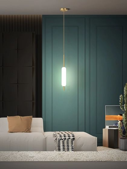 A single minimalist pendant with a frosted light tube. This sleek design is perfect for a modern living room or beside a bed.