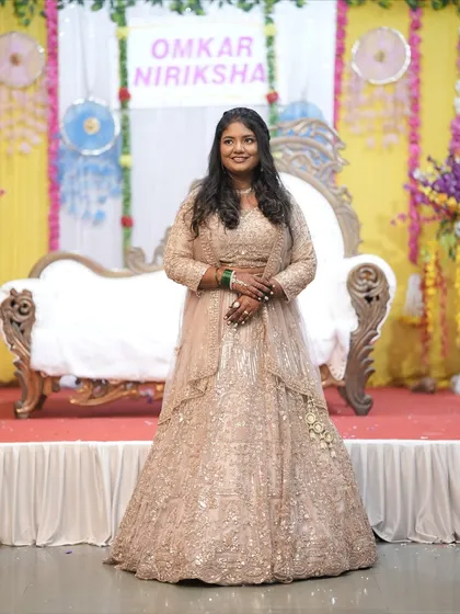 Here is a happy client looking radiant on her engagement day. She is wearing one of my heavily embellished beige lehengas. Seeing my clients celebrate their special moments in my outfits is the best part of what I do.