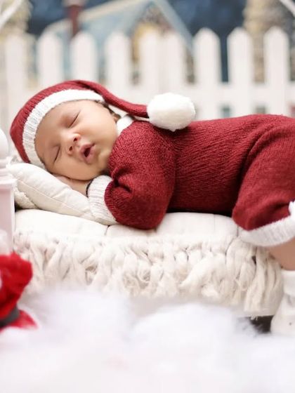A close-up of our little Santa, sleeping soundly before his big night. The knitted red suit and hat add a cozy and adorable touch to the Christmas theme.