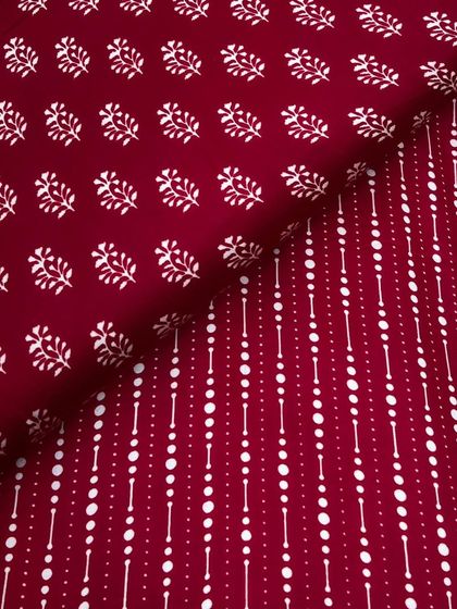 A deep maroon version of our printed modal satin, featuring a mix of buti and geometric prints. The fabric's smooth feel and elegant drape make it a customer favorite.
