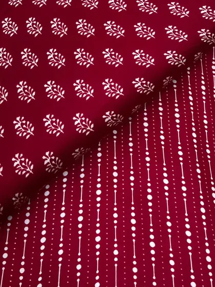 A deep maroon version of our printed modal satin, featuring a mix of buti and geometric prints. The fabric's smooth feel and elegant drape make it a customer favorite.