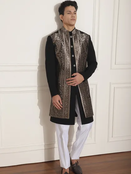 This black Indo-Western outfit with a stunning silver embroidered long jacket is a perfect choice for a Sangeet or reception. It's a glamorous look that is sure to turn heads.