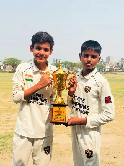 Two of our champions celebrating with the trophy. Teamwork makes the dream work.