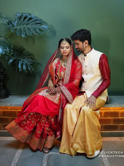 An intimate moment between the couple, seated closely together and sharing a quiet look.