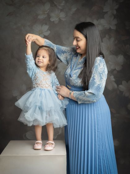 A sweet dance between mother and daughter. These candid moments of joy are what make a family photoshoot so special.