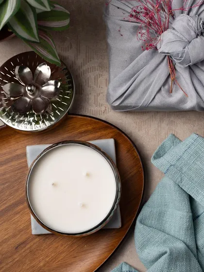 The same beautiful three-wick candle, this time paired with a grey Furoshiki-wrapped gift, showing how you can customize the look.