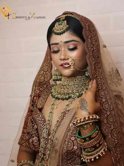 A full shot of a bridal demonstration, showing the beautiful details of the lehenga, jewelry, and the expertly applied makeup.