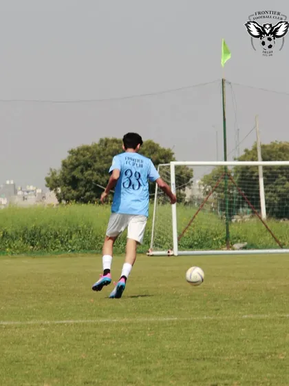 A player takes a shot on goal during a practice match. We focus on creating real-game scenarios to sharpen our players' finishing skills.