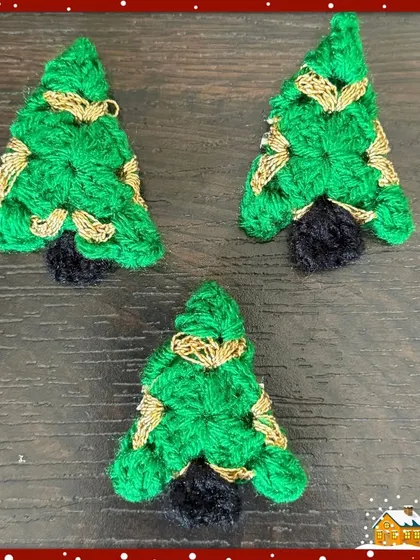 My Christmas tree brooches, complete with a dark trunk and golden garland details, are a classic choice for a festive accessory.