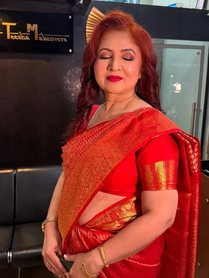 A serene portrait of the mom, with her eyes closed, showing the beautiful and subtle eye makeup.