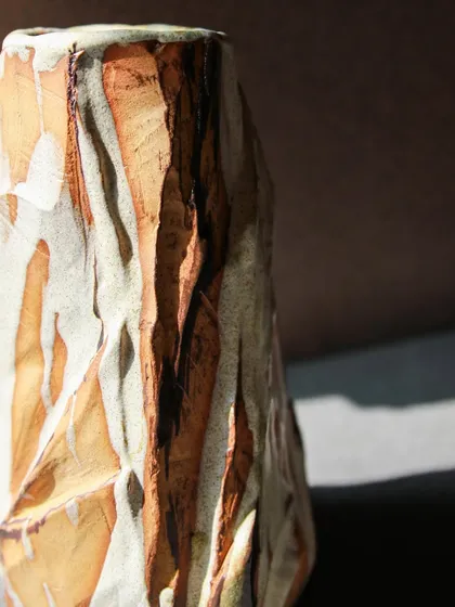 The sharp, faceted edges of this Kurinuki vase create a strong silhouette. The technique allows for so much expression, turning a simple vase into a piece of art.