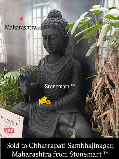 A close-up shot of the 4-foot black marble Buddha, highlighting the smooth finish and detailed carving of the robes and facial features. This piece was delivered to a happy client in Chhatrapati Sambhajinagar.