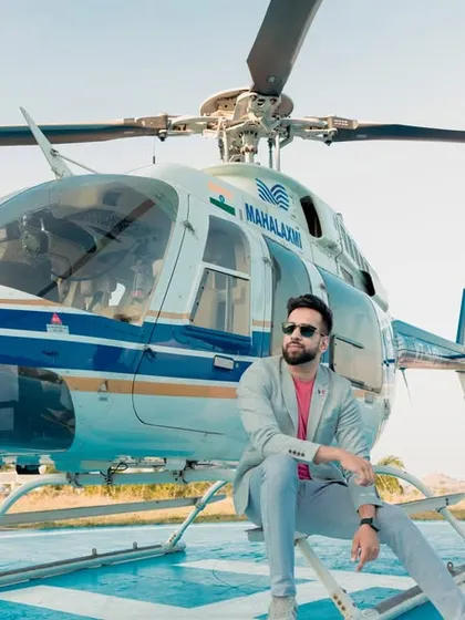 Making a grand entrance into their new life together. This stylish shot from a helicopter pre-wedding shoot in Pune is the definition of luxury and modern romance, creating an unforgettable memory.