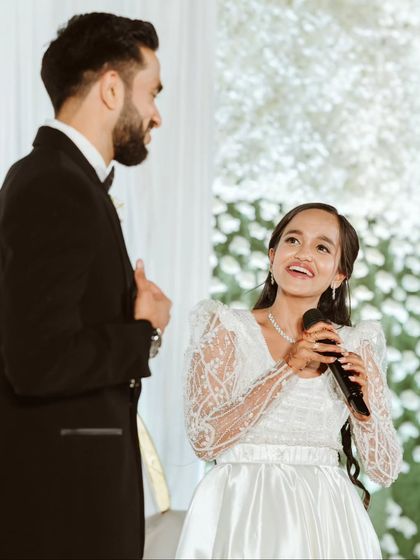 A heartfelt moment on stage as the bride, Ela, shares a few words with her husband, Ryan. My role as an anchor is to create a comfortable space for these genuine emotions to shine through.