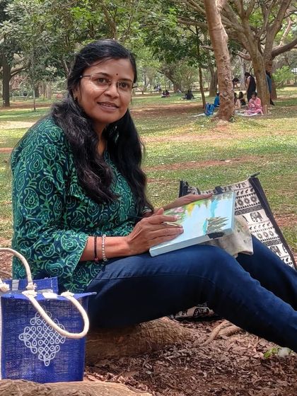 A happy moment, sitting on the roots of a tree and painting.