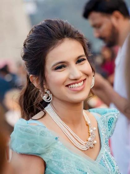 The happiest smiles. Her natural, glowing makeup is perfect for celebrating this special moment.