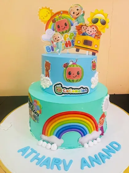 Another delightful Cocomelon cake, showcasing the characters, rainbow, and personalized name, making it a dream come true for any young fan.