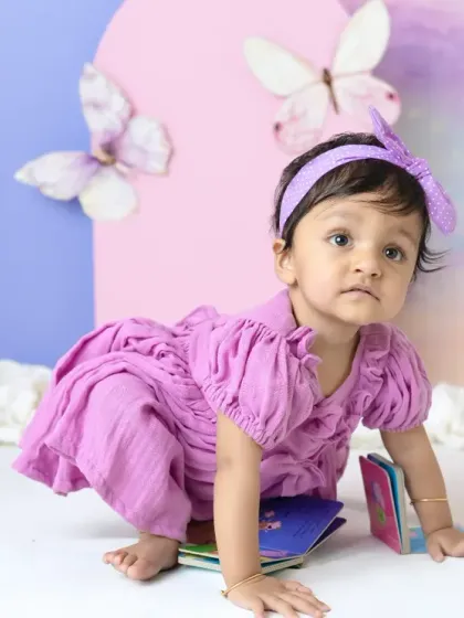 A magical unicorn and butterfly theme for a first birthday. The pastel colors, whimsical props, and dreamy backdrop create a true fairy tale setting.