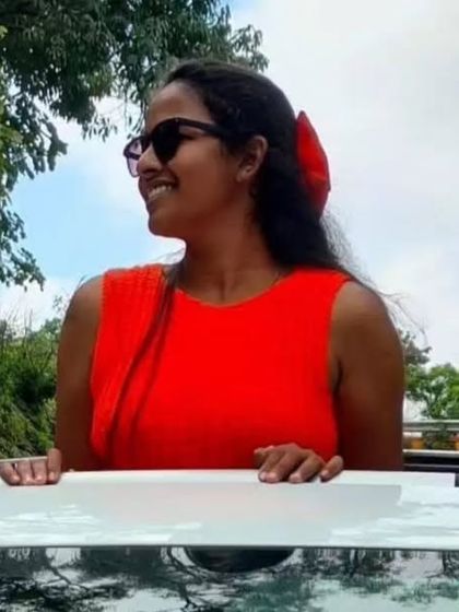 A client enjoying her day out in a vibrant orange crochet top I made for her.