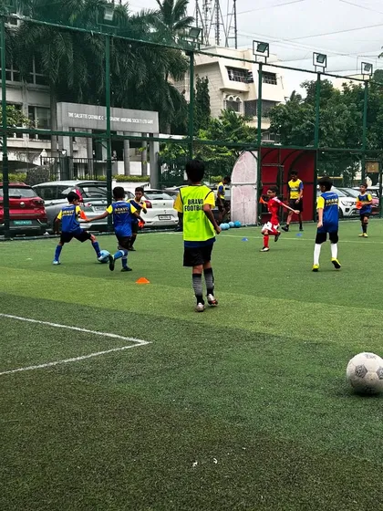 A practice match in full swing, where players apply the skills they have learned.