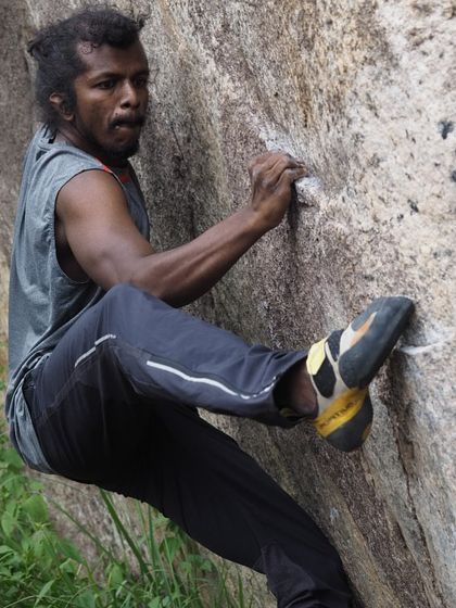 A close up of Subhash bouldering, his determination clear on his face. The "People of Romp" series tells the stories of how our members discovered their love for climbing.