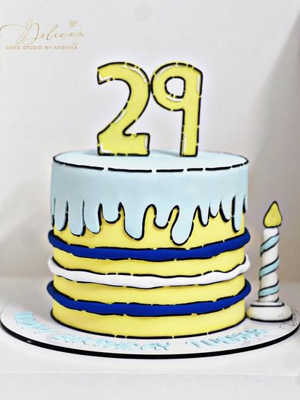 Another look at our fun comic cake. Every element, including the candle, is designed to look like it's straight out of a comic book.