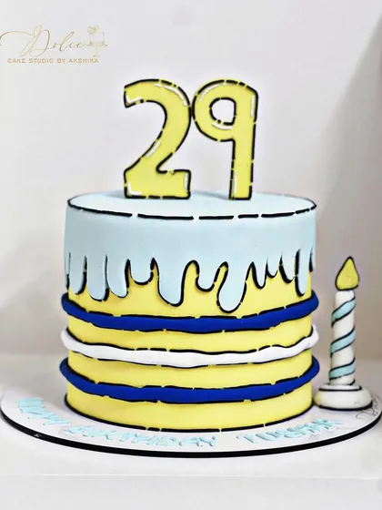 Another look at our fun comic cake. Every element, including the candle, is designed to look like it's straight out of a comic book.