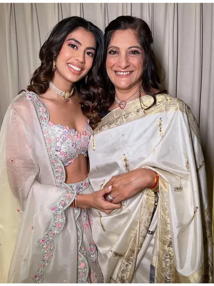 One of my favorite moments is getting the whole family ready. Here's the beautiful bride with her equally stunning mother, both glowing and ready for the engagement ceremony.