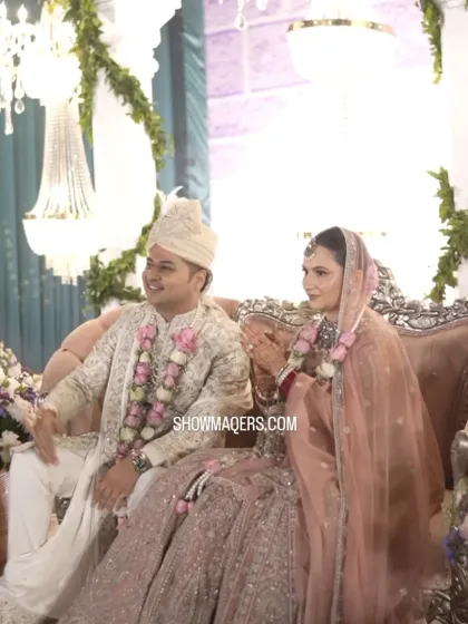The happy couple, Rohan and Ashima, sharing a lighthearted moment during their wedding ceremony.