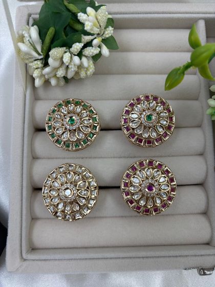 A collection of our traditional circular Kundan rings. These adjustable rings are available in multiple color combinations, including green, red, and all-white, making them a great impulse buy for customers.