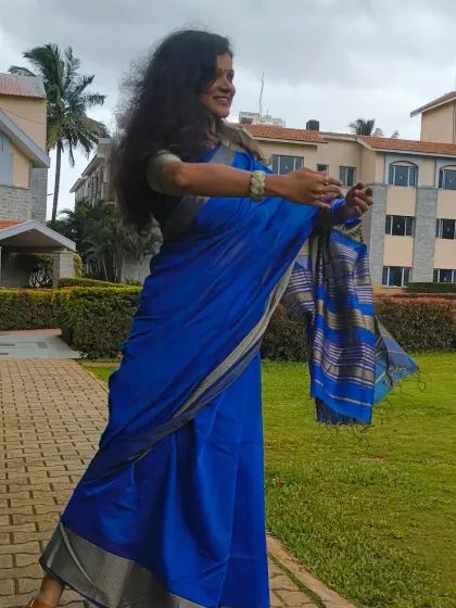Sometimes the Bangalore weather and a beautiful saree are all the inspiration I need. This candid shot captures a moment of spontaneous dance and happiness.