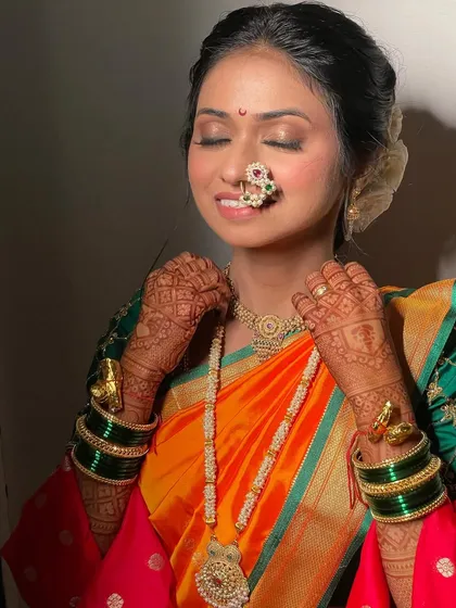 A moment of bliss. This shot captures the soft, shimmering eyeshadow and the overall radiance of the bride.