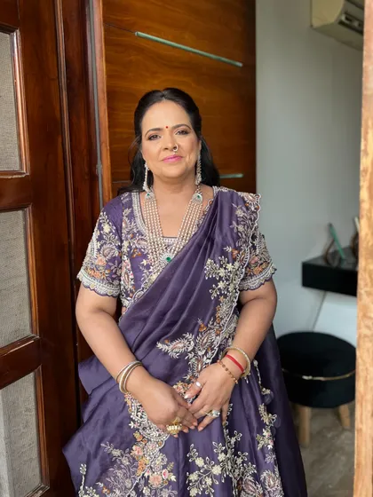 A portrait of the beautiful mother of the groom. Her look was completed with a multi-layered pearl necklace from Hissaria Diamonds and fresh, glowing makeup.