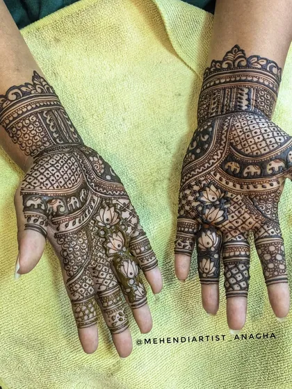 A view of both hands, showing the complete minimal bridal design. The patterns are balanced and use traditional elements in a contemporary way.