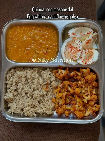 A high-protein, low-carb meal of quinoa, red masoor dal, boiled egg whites, and cauliflower palya. This is an ideal meal for fat loss and muscle maintenance.