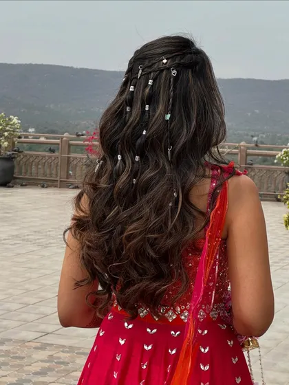 Another view of the carnival hairstyle, showing the delicate silver beads woven into the braids.