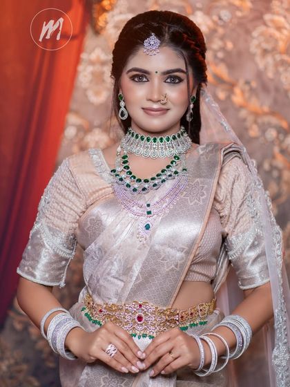 A confident portrait of the model, her smile lighting up the room and complementing the sparkling jewellery.