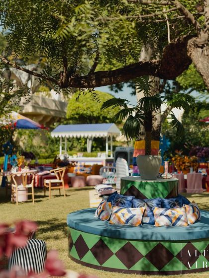 A lounge area from 'The Roots' Mehendi, where traditional decor was reimagined through a modern, graphic lens. Custom-printed cushions and sculptural furniture created an artful and joyful atmosphere.