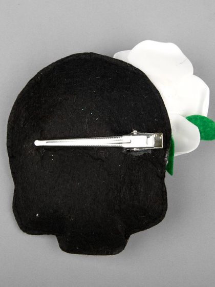 The back of the skull accessory, showing the clip mechanism.