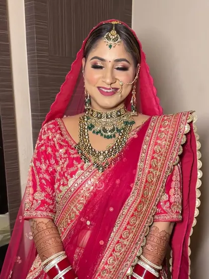 A serene portrait of the Punjabi bride, her eyes closed to showcase the beautiful, soft-glam eye makeup.