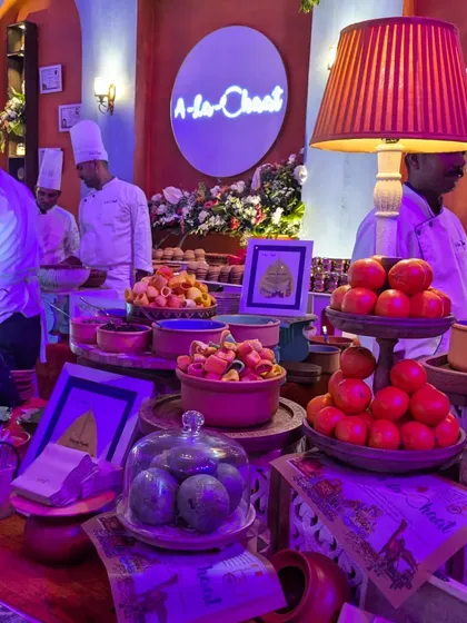 A vibrant and bustling live chaat counter from our 'A-la-Chaat' offering. This setup brings the lively flavors of Indian street food to any event with a gourmet twist.