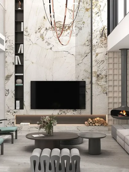 For this double-height living room, we made a statement with a suspended fireplace, creating a dramatic yet cozy focal point. The design is balanced with a striking marble accent wall, minimalist furniture, and a grand custom chandelier, showcasing our ability to handle architectural scale with elegance.
