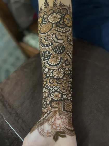 The design extending down the arm, showing how the different elements connect to create a full sleeve.