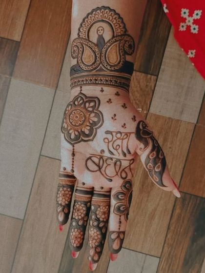 A single-hand design for Rakshabandhan, featuring "Rakhi Bandhan" calligraphy and a peacock motif.