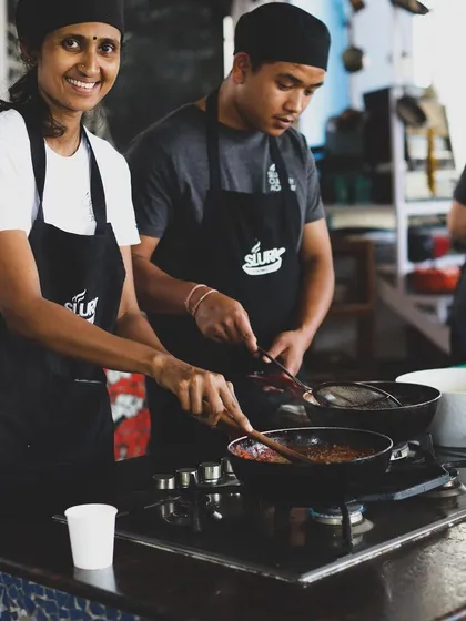 A student smiles while learning in our professional program. We believe passion is the most important ingredient for a successful culinary career.