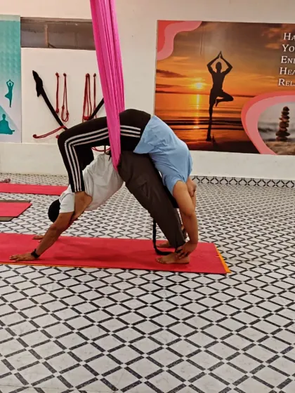 Combining Acro Yoga with aerial silks adds another dimension of support and challenge. Here, we use the hammock to assist with a partner backbend, allowing for a deeper stretch.