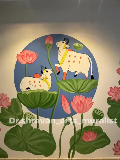 This wall mural captures the serene beauty of Pichwai art. The composition, featuring cows amidst lotus pads under a soft spotlight, creates a peaceful and divine atmosphere in the room.