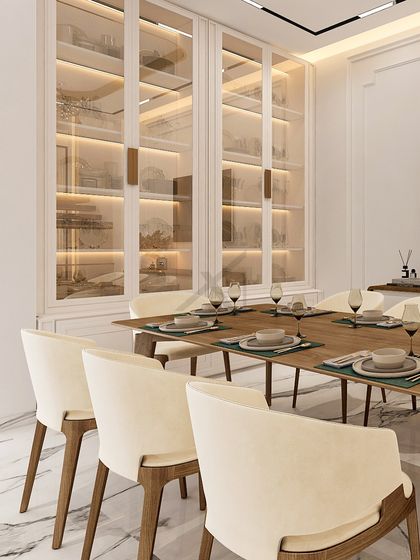 A closer look at the custom display cabinets, where integrated lighting highlights the curated dinnerware and decor.