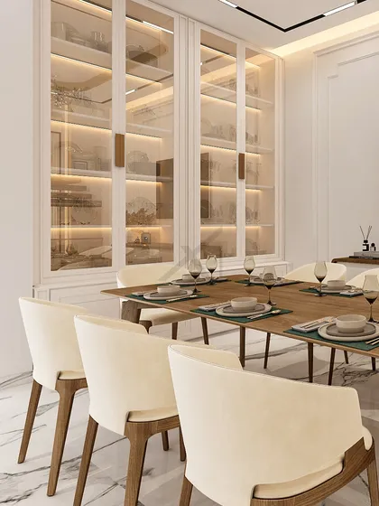 A closer look at the custom display cabinets, where integrated lighting highlights the curated dinnerware and decor.